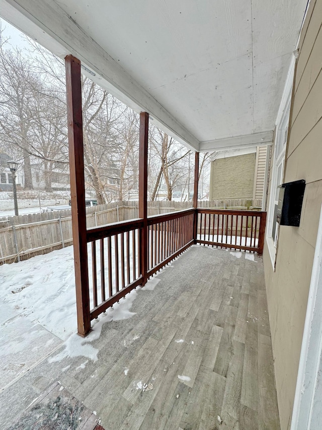 view of snow covered deck