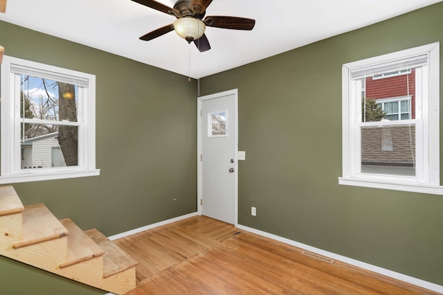 entryway featuring hardwood / wood-style flooring and ceiling fan