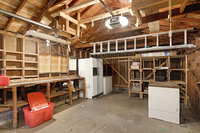 basement with white fridge with ice dispenser