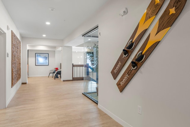 corridor featuring light hardwood / wood-style floors