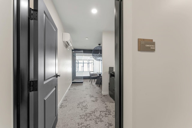 corridor featuring a wall mounted AC and carpet floors