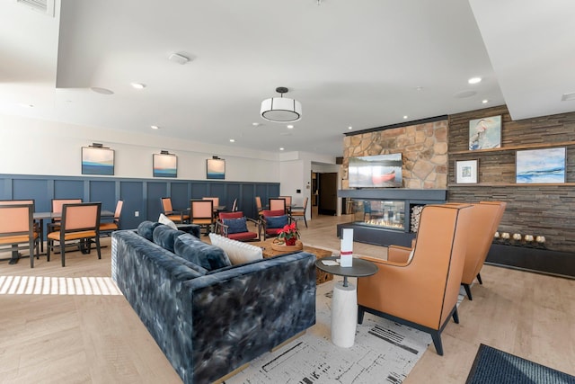 living room featuring light hardwood / wood-style floors and a fireplace