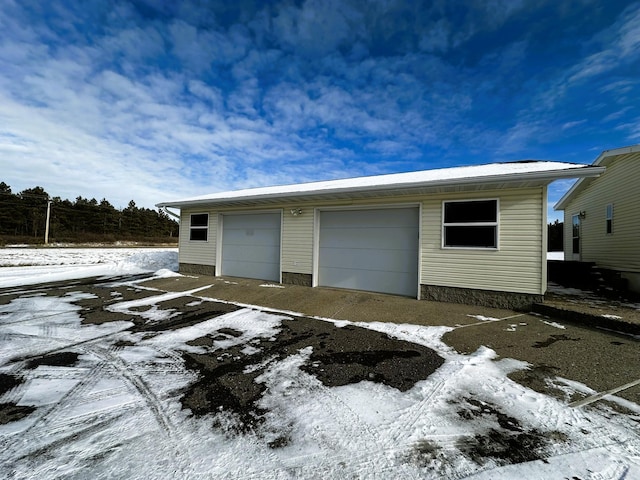 view of snow covered garage