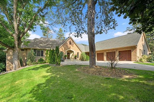 view of front of house with a front lawn and a garage