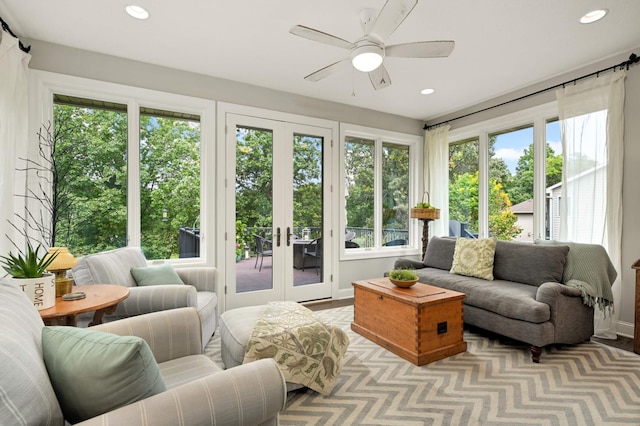 sunroom / solarium featuring ceiling fan