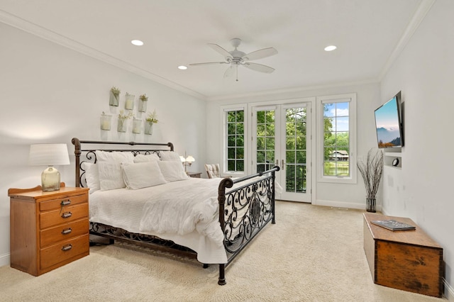 bedroom with ceiling fan, access to outside, crown molding, light carpet, and french doors