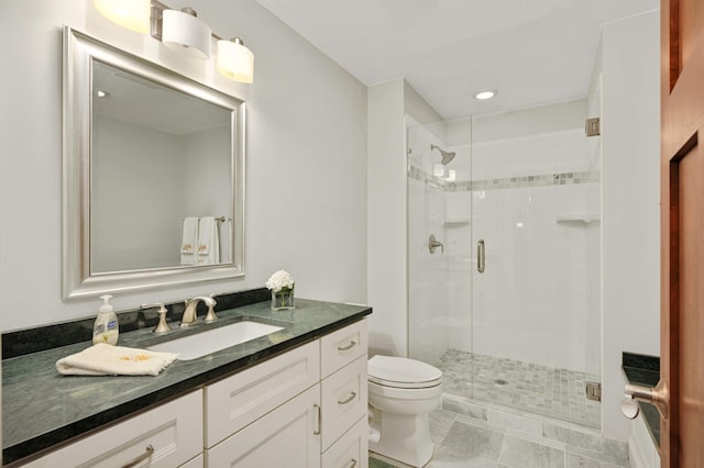 bathroom with vanity, toilet, tile patterned floors, and an enclosed shower