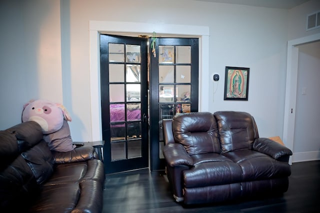 living room with dark hardwood / wood-style flooring