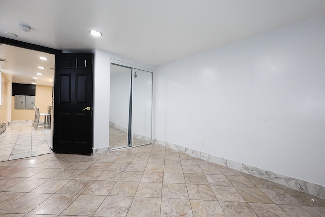 empty room featuring light tile patterned floors