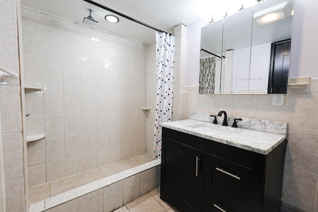 bathroom featuring tile walls, tile patterned floors, and walk in shower