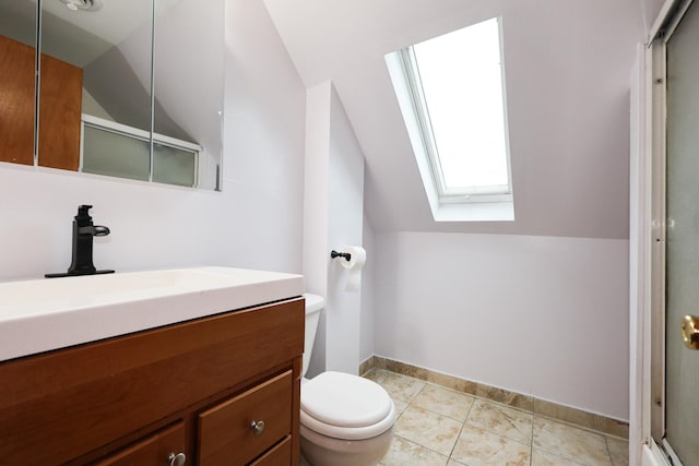 bathroom with vaulted ceiling with skylight, tile patterned flooring, vanity, toilet, and a shower with shower door