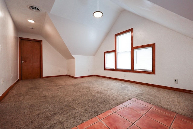 additional living space with carpet and lofted ceiling