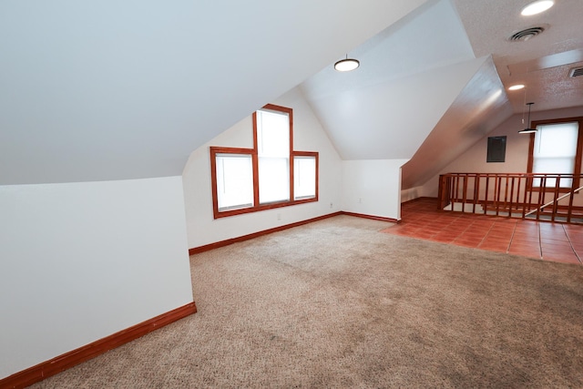 bonus room featuring carpet and lofted ceiling