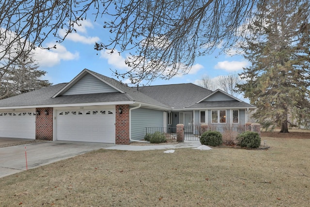 ranch-style house with a garage and a front yard