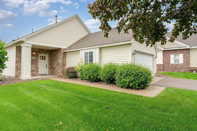 2695 Oak Ridge Trl, Woodbury, MN 55125 - view of front facade featuring brick siding, a front yard, a shingled roof, and an attached garage