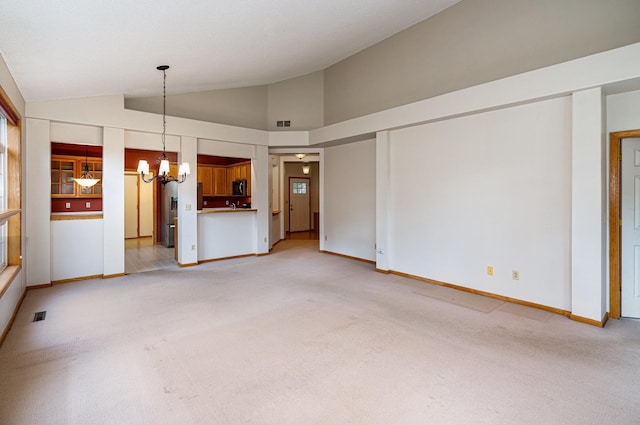 2695 Oak Ridge Trl, Woodbury, MN 55125 - unfurnished living room with a chandelier, light carpet, and lofted ceiling