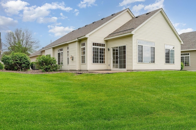 2695 Oak Ridge Trl, Woodbury, MN 55125 - rear view of property with a shingled roof, a yard, and a patio