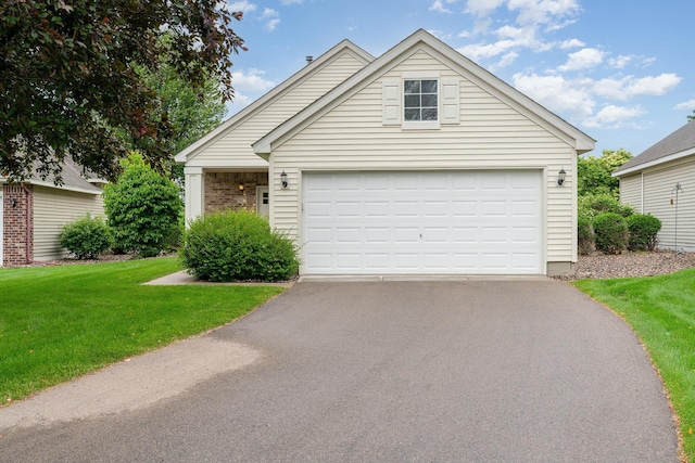 2695 Oak Ridge Trl, Woodbury, MN 55125 - view of front of house featuring a front yard and asphalt driveway