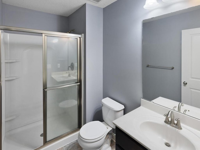 bathroom with vanity, toilet, and walk in shower