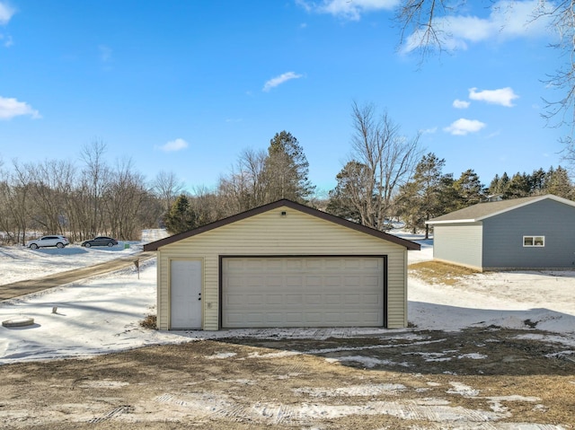 view of snow covered garage