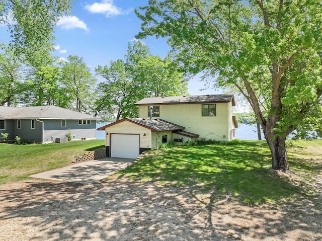 7364 Isaak Ave NW, Annandale, MN 55302 - view of front of home featuring concrete driveway, an attached garage, and a front lawn