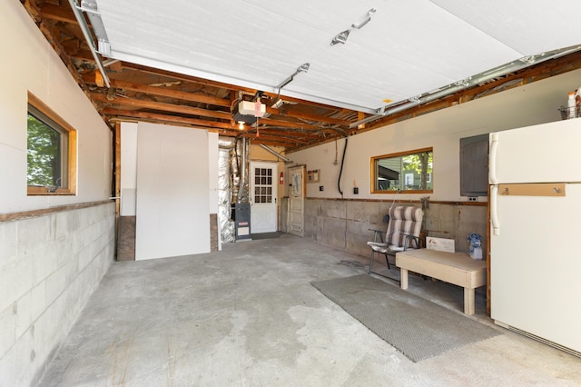 7364 Isaak Ave NW, Annandale, MN 55302 - garage with freestanding refrigerator and a garage door opener