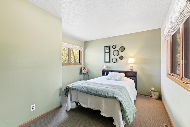 7364 Isaak Ave NW, Annandale, MN 55302 - carpeted bedroom featuring baseboards and a textured ceiling