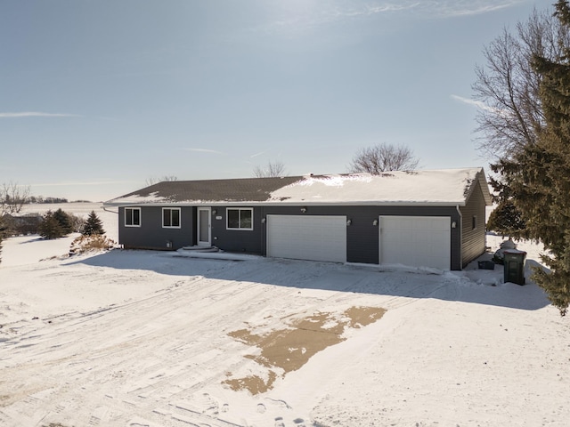 single story home featuring a garage