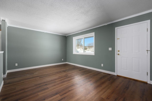 interior space with dark hardwood / wood-style flooring, crown molding, and a textured ceiling