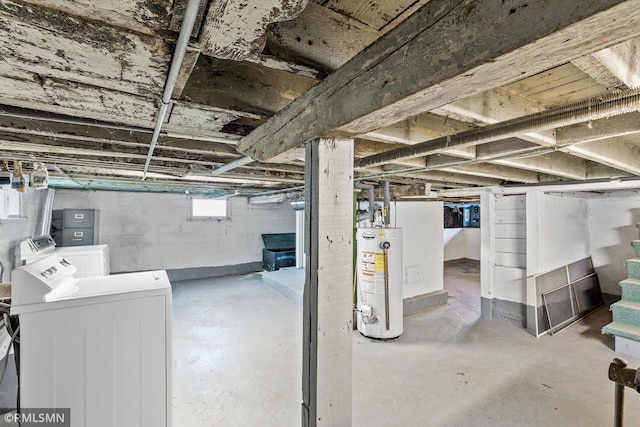 basement with gas water heater and washing machine and clothes dryer