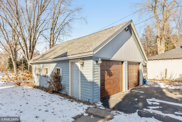 view of snow covered garage