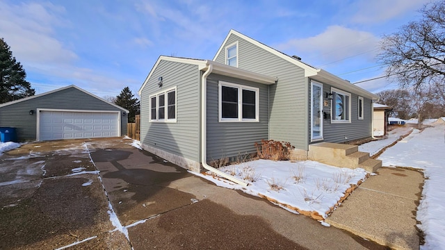 view of front of home with an outbuilding and a garage