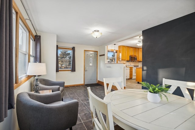 dining room with dark tile patterned floors