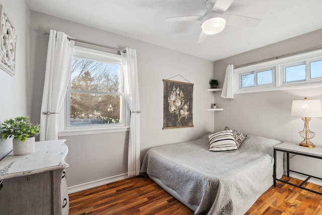 bedroom featuring dark hardwood / wood-style floors and ceiling fan