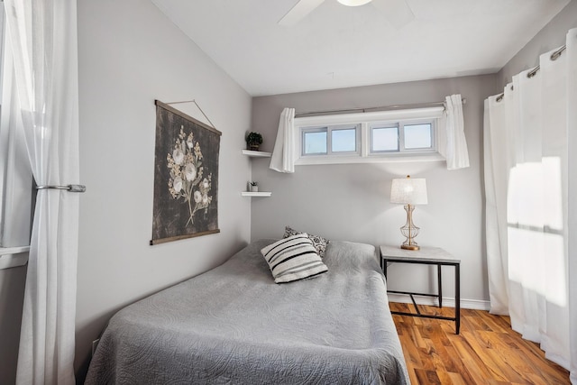 bedroom featuring ceiling fan and light hardwood / wood-style flooring