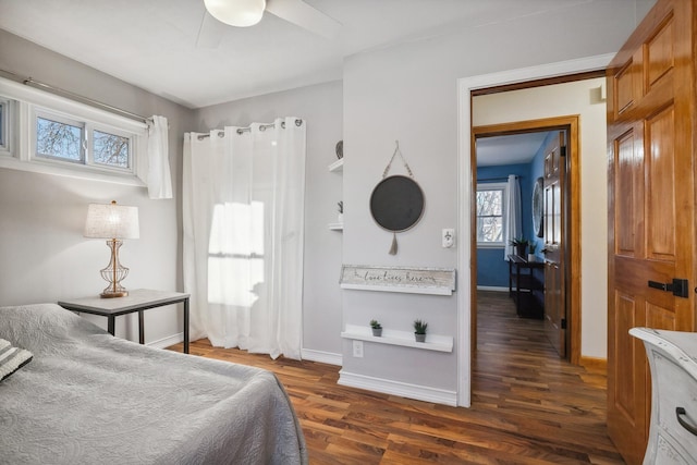 bedroom featuring dark wood-type flooring and ceiling fan