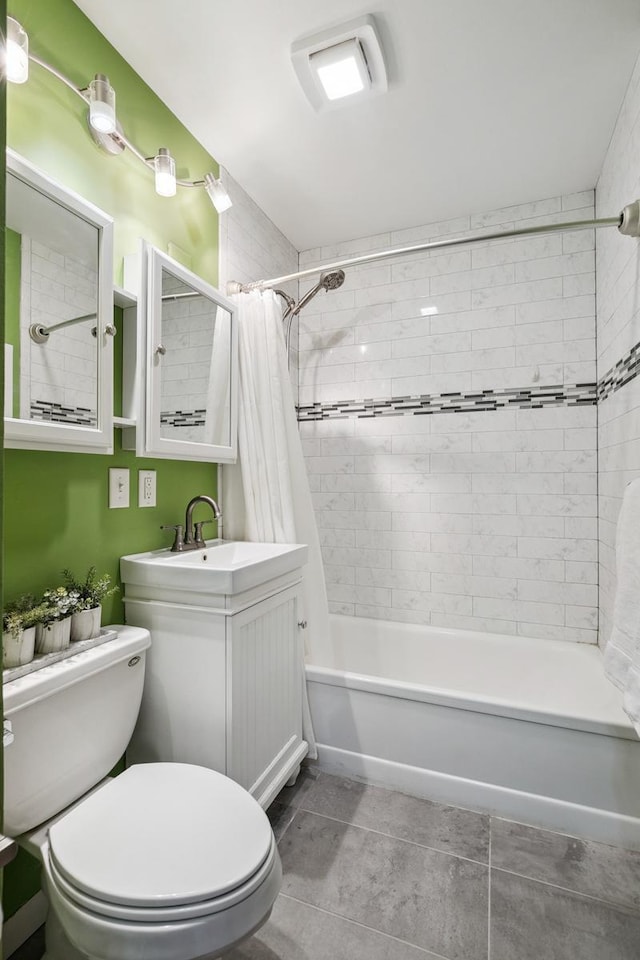 full bathroom featuring tile patterned flooring, vanity, shower / bath combination with curtain, and toilet