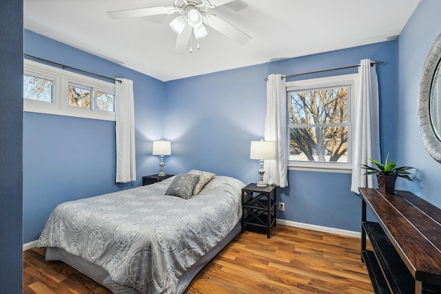 bedroom featuring hardwood / wood-style flooring and ceiling fan