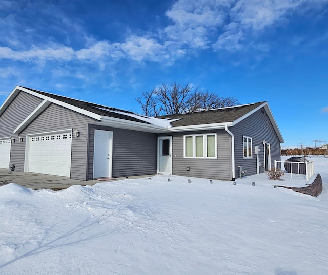 ranch-style house featuring a garage