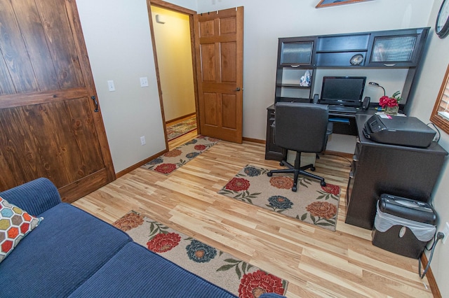 office area with light wood-type flooring