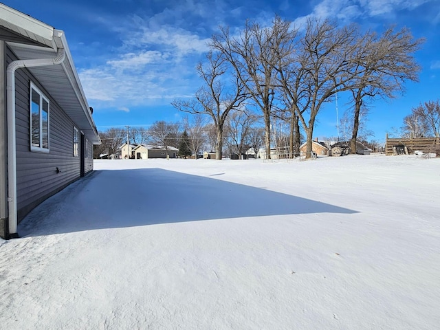 view of yard layered in snow