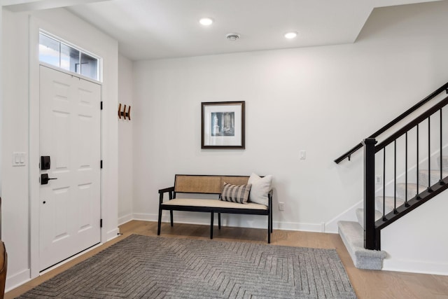 entryway with hardwood / wood-style flooring