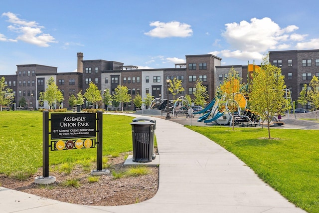 view of community with a lawn and a playground