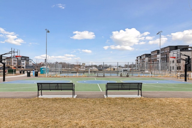 view of sport court featuring a yard and tennis court