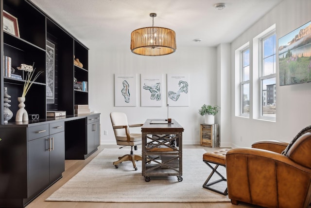 office with baseboards and light wood-type flooring