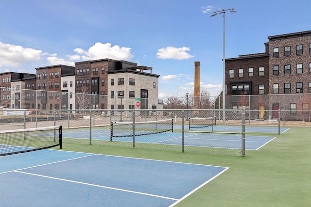 view of tennis court with fence