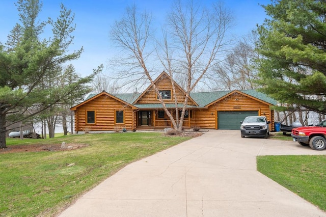 log-style house featuring a front yard, a garage, and a porch