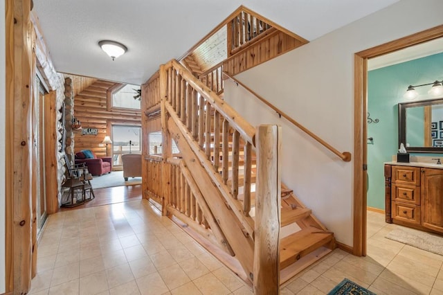 stairway featuring log walls