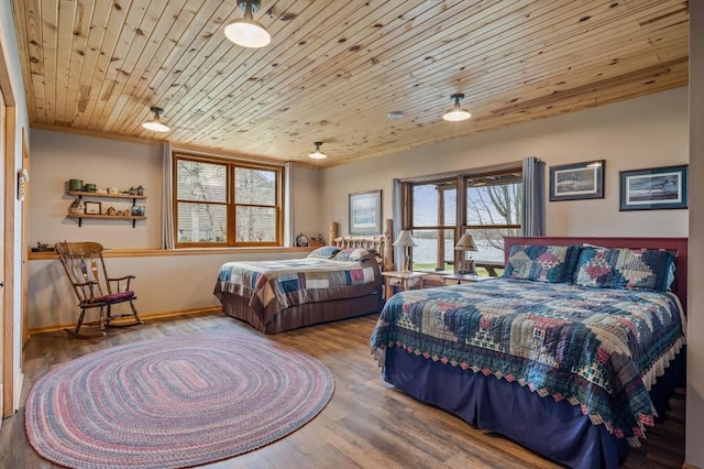 bedroom featuring wooden ceiling, wood-type flooring, and crown molding