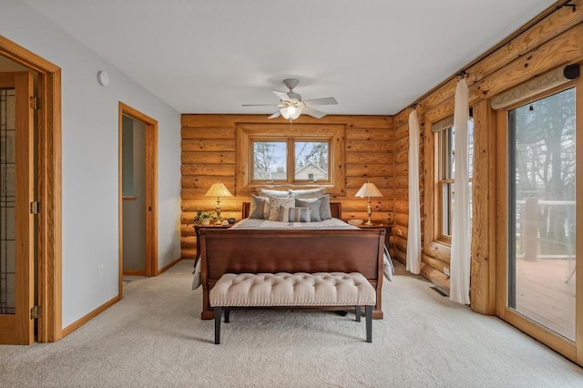 carpeted bedroom featuring ceiling fan, log walls, and access to outside